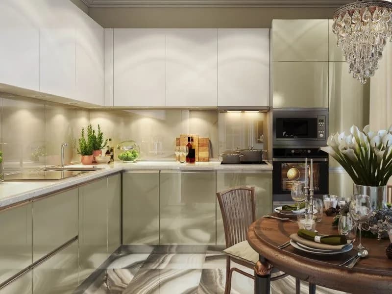 Kitchen cabinetry in a glossy ecru finish with brushed hardware